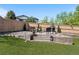 Beautiful backyard patio with ample seating and an outdoor fireplace, perfect for relaxing and entertaining at 4009 Manorbrier Cir, Castle Rock, CO 80104