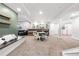 Spacious basement featuring carpeted floors, a bar area, and ample seating for entertaining at 4009 Manorbrier Cir, Castle Rock, CO 80104