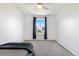 Bedroom with neutral carpet, ceiling fan and window with dark-colored curtains at 4009 Manorbrier Cir, Castle Rock, CO 80104