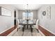 Elegant dining room with wood floors, decorative accents, and seating for eight at 4009 Manorbrier Cir, Castle Rock, CO 80104