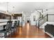 Spacious kitchen with an island and a view into the open living room at 4009 Manorbrier Cir, Castle Rock, CO 80104
