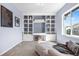 Bright living room features built in shelving and a large window at 4009 Manorbrier Cir, Castle Rock, CO 80104