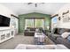 Bright living room with vaulted ceiling, comfortable seating, and a neutral color palette at 4009 Manorbrier Cir, Castle Rock, CO 80104