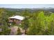 Charming brick home with a metal roof nestled in a lush forest with breathtaking mountain views at 401 Highway 72, Golden, CO 80403