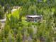 Aerial view of a secluded home surrounded by lush forest at 401 Highway 72, Golden, CO 80403