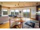 Bright foyer area featuring a spiral staircase, natural light, wood floors and views to the mountains at 401 Highway 72, Golden, CO 80403