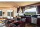 Stylish kitchen featuring dark wood cabinets, an island with seating, and scenic views at 401 Highway 72, Golden, CO 80403