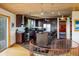 Open kitchen with an island, stainless steel appliances, wooden ceiling and views from the stairs at 401 Highway 72, Golden, CO 80403