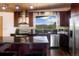 Updated kitchen with stainless steel appliances, granite countertops, and plenty of cabinet space at 401 Highway 72, Golden, CO 80403