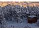 Picturesque winter landscape with snow-covered trees and majestic mountain views in the background at 401 Highway 72, Golden, CO 80403