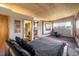 Comfortable bedroom featuring an ensuite bathroom and mountain views at 401 Highway 72, Golden, CO 80403