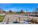 Outdoor basketball court with well-maintained surface and hoops for recreational play at 18304 Caffey Dr, Parker, CO 80134