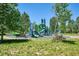 Fun playground area with multiple slides, climbing structures, and seating areas for parents at 18304 Caffey Dr, Parker, CO 80134