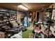 Unfinished basement with shelving, washing machine, dryer, and many stored personal items at 841 S 6Th Ave, Brighton, CO 80601