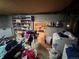 Unfinished basement with shelving, exposed piping, and washer and dryer appliances at 841 S 6Th Ave, Brighton, CO 80601