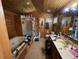 Bathroom with wood-paneled walls, tiled floors, shower and double sinks at 841 S 6Th Ave, Brighton, CO 80601