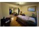 Bedroom view with hardwood floors leading to the living room at 841 S 6Th Ave, Brighton, CO 80601