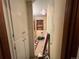 Hallway view with built in storage leading into the cluttered area at 841 S 6Th Ave, Brighton, CO 80601
