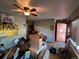 Spacious living room featuring hardwood floors, a ceiling fan and access to the entrance and additional rooms at 841 S 6Th Ave, Brighton, CO 80601