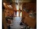 Unique living room with wood paneled walls, skylight and multiple deer head mounts, giving it a rustic cabin feel at 841 S 6Th Ave, Brighton, CO 80601