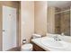 Bathroom featuring tile floor, single sink vanity, toilet and tiled shower at 27124 Sun Ridge Dr, Evergreen, CO 80439