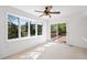Bright living room featuring a sliding glass door to a deck with scenic views at 27124 Sun Ridge Dr, Evergreen, CO 80439