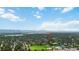 Panoramic aerial view showcasing this property's proximity to Harlow Park, lake, mountains, and community amenities at 3317 W Belmont Ave, Littleton, CO 80123