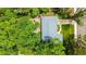 Aerial view of home showcasing the roof, yard, driveway, and surrounding greenery at 3317 W Belmont Ave, Littleton, CO 80123