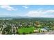 Captivating aerial view highlighting this property's prime location near S Lowell Blvd, a park, pool, and other community amenities at 3317 W Belmont Ave, Littleton, CO 80123