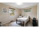 Bedroom with natural light from two windows and carpeted floors at 3317 W Belmont Ave, Littleton, CO 80123