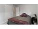 Bedroom featuring neutral decor, carpet, and closet doors at 3317 W Belmont Ave, Littleton, CO 80123