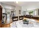 Dining room with hardwood floors adjacent to living room and kitchen at 3317 W Belmont Ave, Littleton, CO 80123