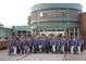 Centennial Academy of Fine Arts facade with Littleton Public Schools signage and group of faculty and staff at 3317 W Belmont Ave, Littleton, CO 80123
