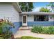 Close up of the front entrance highlighting well-maintained landscaping and inviting curb appeal at 3317 W Belmont Ave, Littleton, CO 80123
