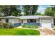 Delightful home exterior featuring lush lawn and landscaping, showcasing curb appeal at 3317 W Belmont Ave, Littleton, CO 80123