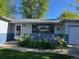 Lovely home featuring colorful flowerbeds, well-kept lawn and nice window views at 3317 W Belmont Ave, Littleton, CO 80123