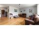 A spacious living room featuring hardwood flooring and comfortable furnishings at 3317 W Belmont Ave, Littleton, CO 80123