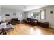 Bright living room features a large window with hardwood flooring at 3317 W Belmont Ave, Littleton, CO 80123