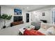 Spacious basement featuring a comfortable seating area and entertainment center with television at 6787 E Exposition Ave, Denver, CO 80224