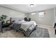 Comfortable bedroom featuring a gray color scheme, plush carpet, and bright natural light at 6787 E Exposition Ave, Denver, CO 80224