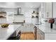 Modern kitchen with stainless appliances, stylish countertops, and ample cabinet space at 6787 E Exposition Ave, Denver, CO 80224