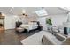 Bright main bedroom featuring a skylight, hardwood floors, sitting area and plenty of natural light at 6787 E Exposition Ave, Denver, CO 80224
