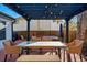 Charming outdoor patio with a pergola, seating, and brick flooring, perfect for entertaining at 6787 E Exposition Ave, Denver, CO 80224