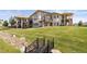 Stunning backyard featuring a veranda, balcony, wrought iron railing, and a decorative bridge at 3358 Castle Butte Dr, Castle Rock, CO 80109