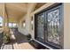 Elegant front door with decorative ironwork and a welcoming porch with scenic views at 3358 Castle Butte Dr, Castle Rock, CO 80109