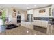Well-appointed kitchen with granite countertops, a stainless steel refrigerator, and custom cabinetry at 3358 Castle Butte Dr, Castle Rock, CO 80109