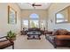 Elegant living room featuring neutral tones, a painting, and comfortable seating at 3358 Castle Butte Dr, Castle Rock, CO 80109