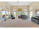 Spacious living room with large windows and comfortable leather seating at 3358 Castle Butte Dr, Castle Rock, CO 80109