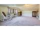 Spacious bonus room with carpeting and plenty of natural light, perfect for a home office or recreation space at 347 Buena Vista Ave, Palmer Lake, CO 80133