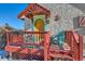 Close-up of colorful front porch with seating area and vibrant yellow front door at 347 Buena Vista Ave, Palmer Lake, CO 80133